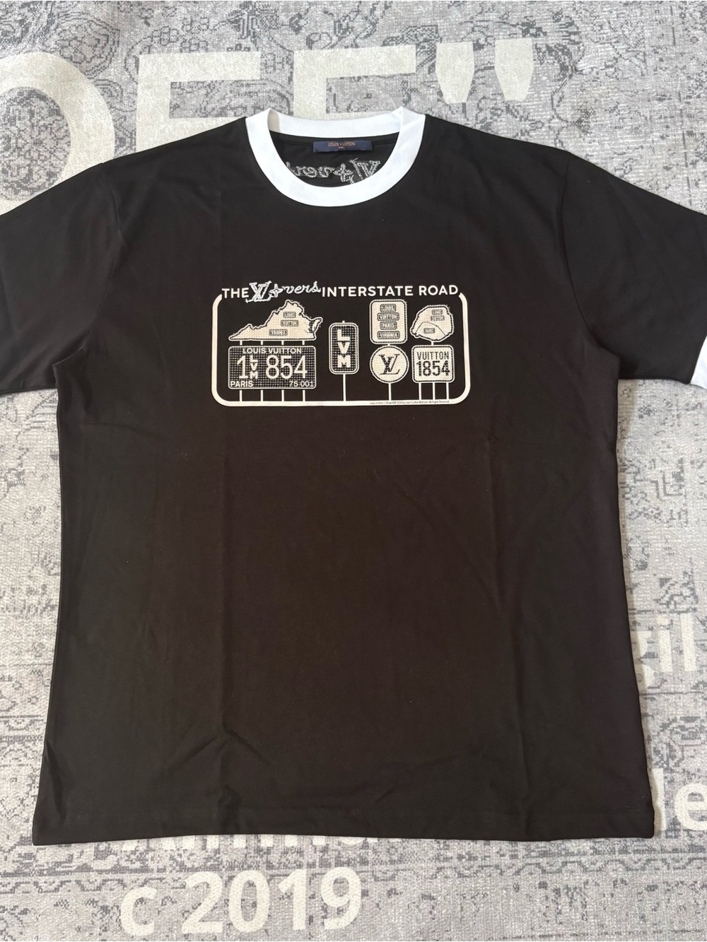 Louis Vuitton Black T-Shirt with White Trim and Graphic
